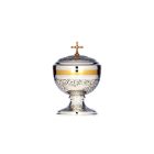 Chiselled silver ciborium with Cross and golden details