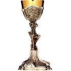 Asymmetrical silver chalice with chiselled liturgical elements