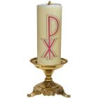 Table candlestick with candle and liturgical motifs on the base