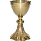 Golden metal chalice with grapes and spikes