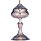 Chiselled silver ciborium with golden cross