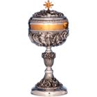 Silver ciborium with liturgical elements in relief