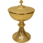 Golden metal ciborium with silver Cross