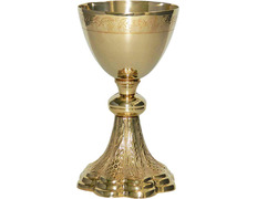 Golden metal chalice with grapes and spikes