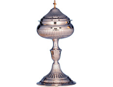 Chiselled silver ciborium with golden cross
