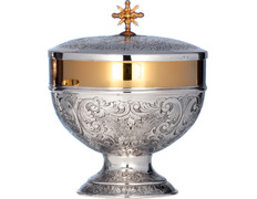 Silver ciborium with vine and grapes chiselled at the base