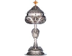Silver ciborium with cherub faces in relief