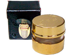 Golden metal chrismera with leather case