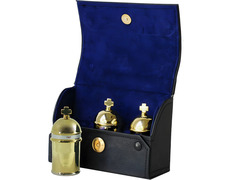 Three gold plated crismeras with case