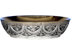 Silver paten with liturgical elements in relief