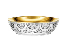 Silver paten with liturgical elements in relief