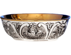 Silver paten with embossed angel face