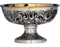 Silver paten with embossed exterior decoration