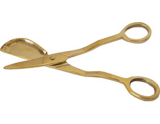 Scissors cuts wax from candles and tapers