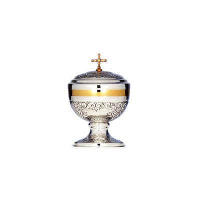 Chiselled silver ciborium with Cross and golden details