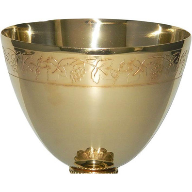 Golden metal chalice with grapes and spikes