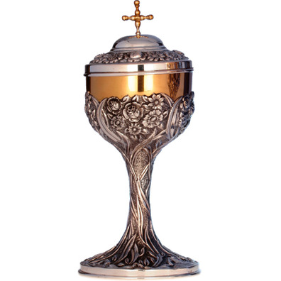 Silver ciborium with chiselled liturgical elements