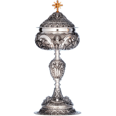 Silver ciborium with cherub faces in relief