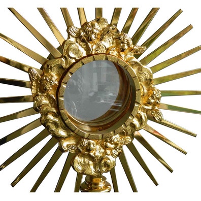 Monstrance in golden metal with rays and Cross