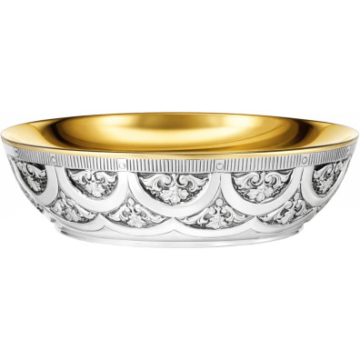 Silver paten with liturgical elements in relief