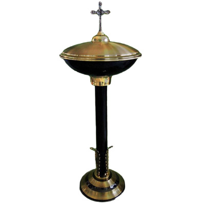 Baptismal font in gold and black metal with lid with Cross