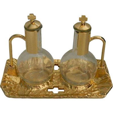 Glass and metal cruets golden color color