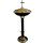 Baptismal font in gold and black metal with lid with Cross