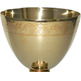 Golden metal chalice with grapes and spikes