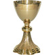 Golden metal chalice with grapes and spikes