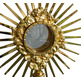 Monstrance in golden metal with rays and Cross