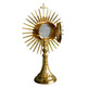 Monstrance in golden metal with rays and Cross