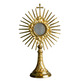 Monstrance in golden metal with rays and Cross