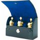 Three gold plated crismeras with case