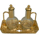 Glass and metal cruets golden color color